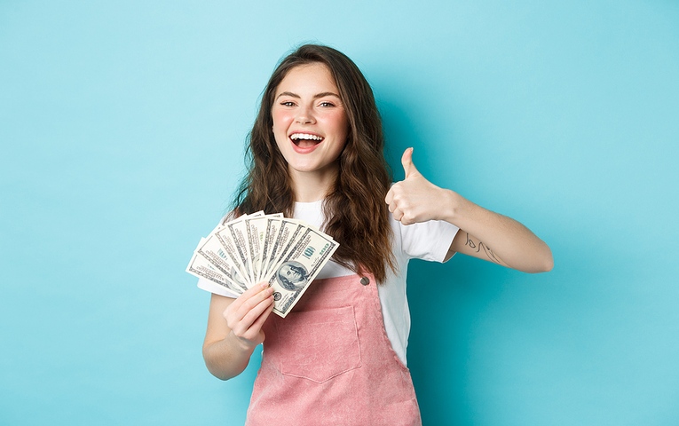 Happy Woman Holding Money