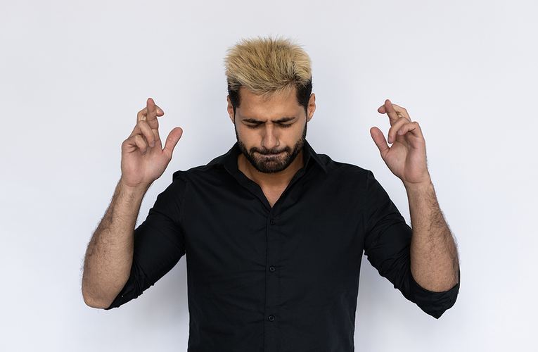 Man Crossing Fingers