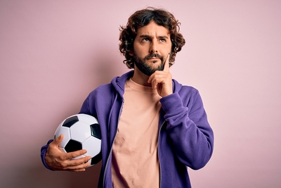 Man Thinking Holding Football